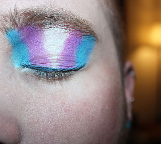 Eyelid with LGBTQ Flag painted on it