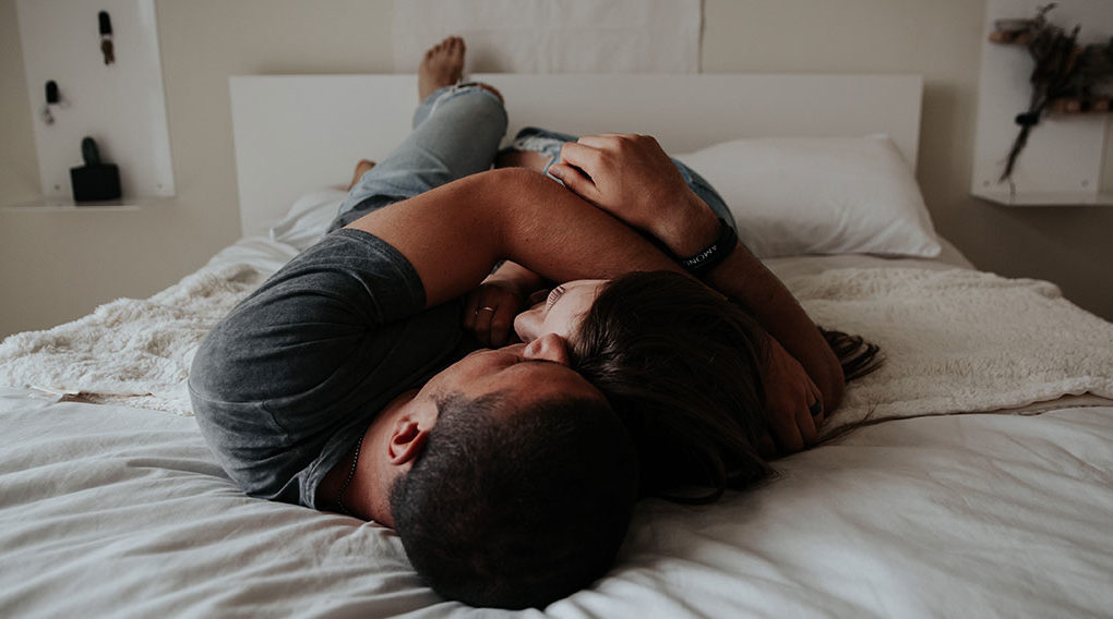 A couple embracing in bed