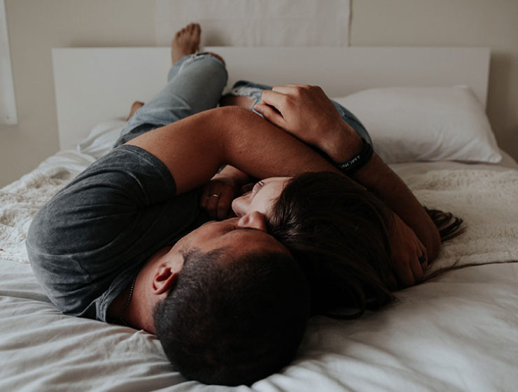 A couple embracing in bed