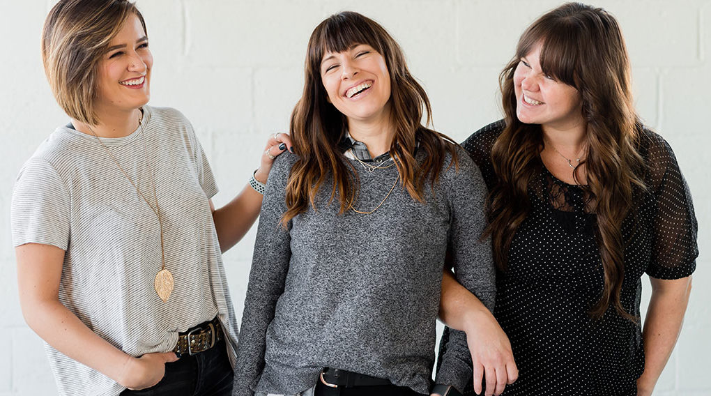 Three woman laughing together