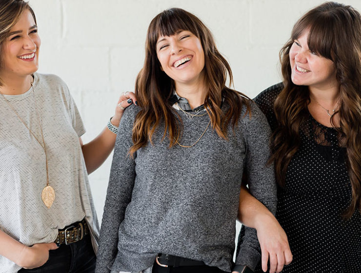 Three woman laughing together