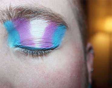trans370x290 A person with LGBTQ colors on their eyes