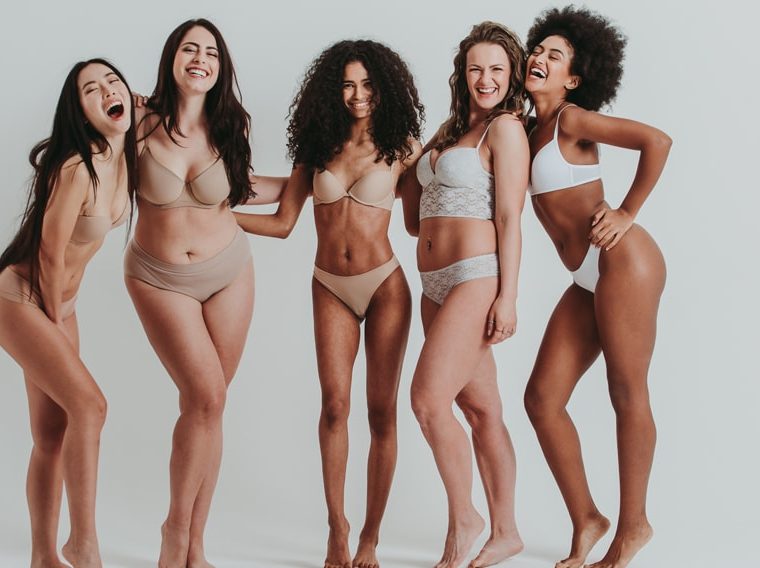 A group of happy women in their underwear.