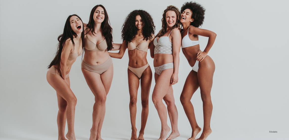 A group of happy women in their underwear.