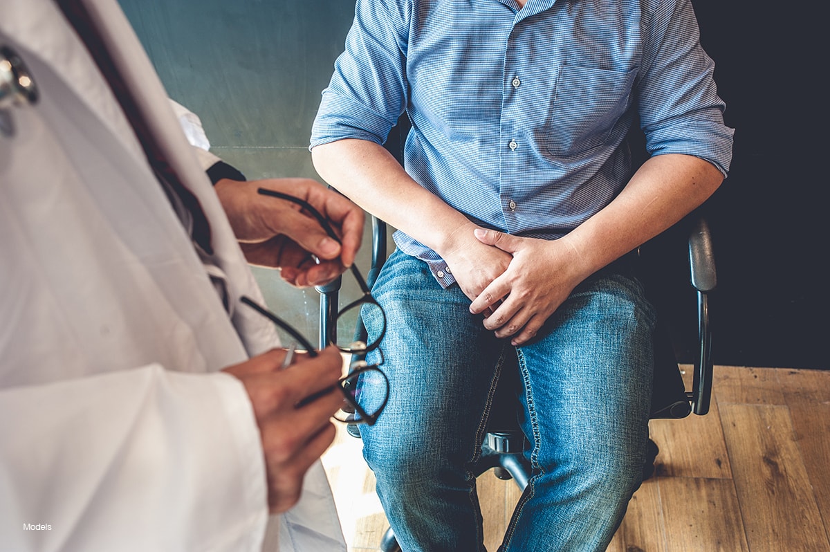 A man at his surgical consultation for genital surgery.