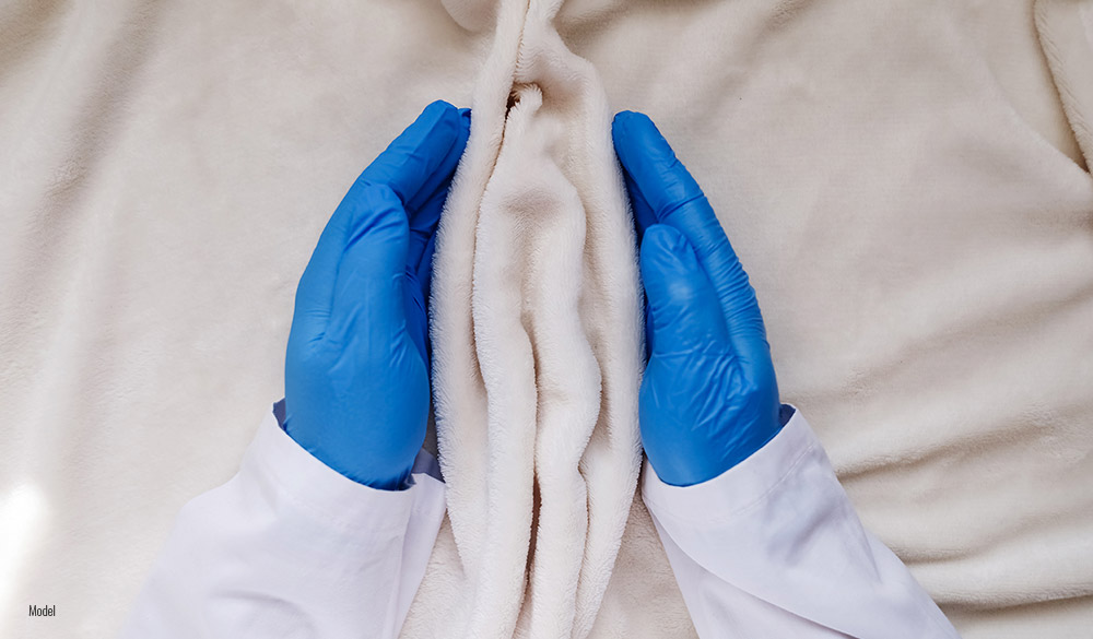 Surgeon holding blanket as Labiaplasty concept