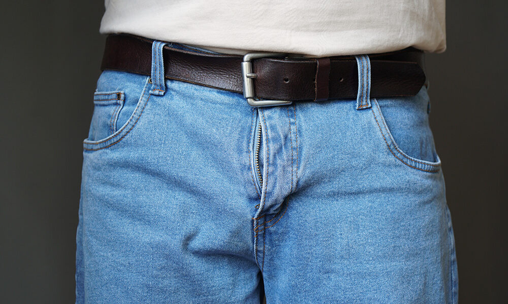 Lower half of a man in jeans