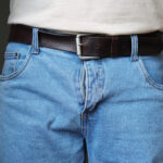 Lower half of a man in jeans