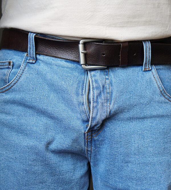 Lower half of a man in jeans
