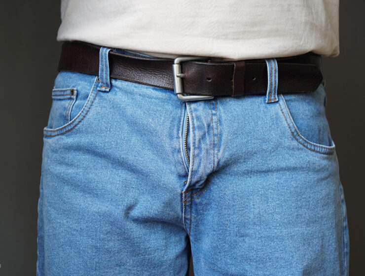 Lower half of a man in jeans