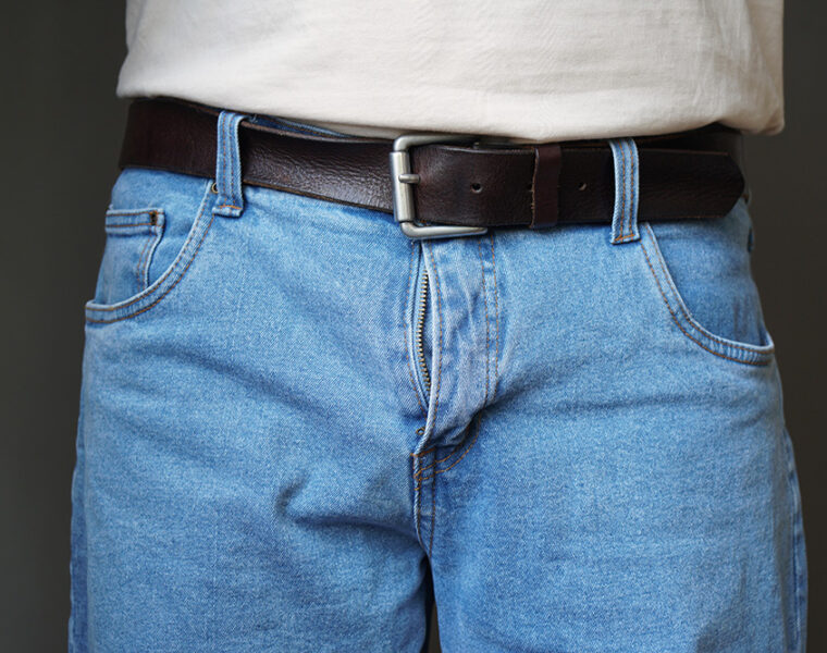 Lower half of a man in jeans