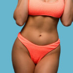 Curvy woman in peach colored underware